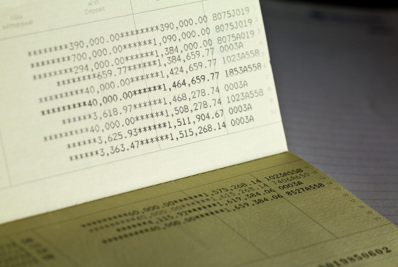 Close-up of a bank statement page filled with rows of numeric figures and asterisks, like a financial ledger above a darker surface.&nbsp;Hispamer Noticias