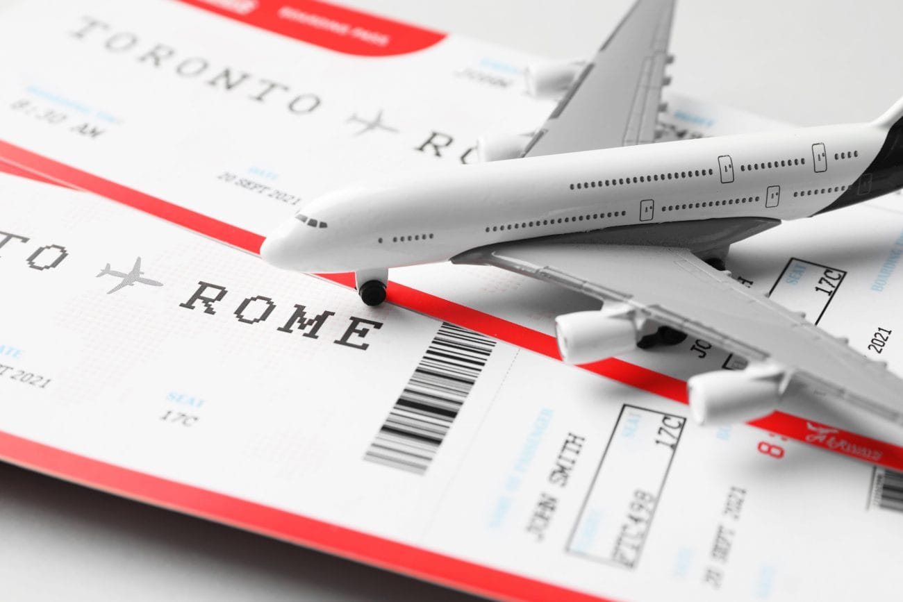 Model airplane atop airline boarding passes and a barcode, evoking travel to Rome.&nbsp;Hispamer Noticias