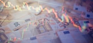 Euro banknotes with green and red candlestick chart lines representing financial trading&nbsp;Hispamer Noticias