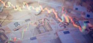 Euro banknotes with green and red candlestick chart lines representing financial trading&nbsp;Hispamer Noticias