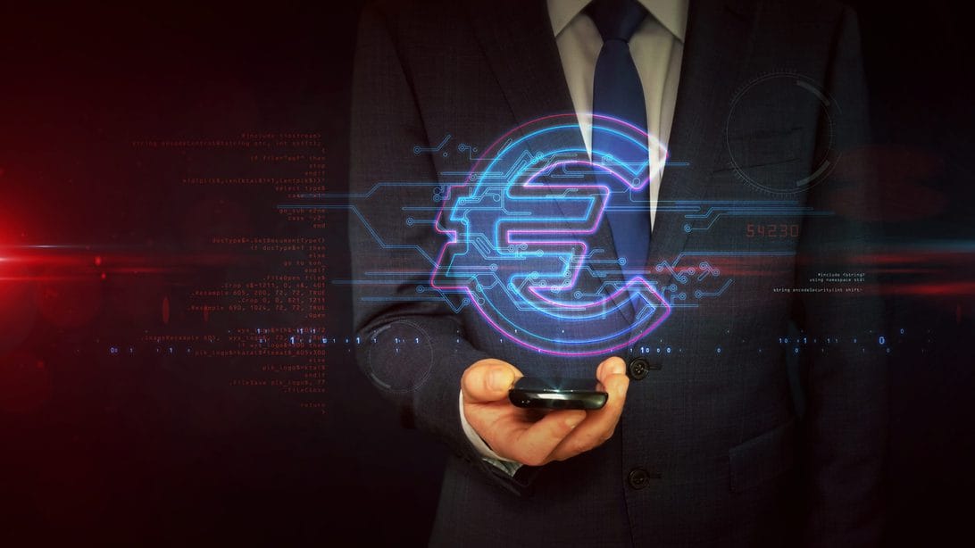 euro digital negociacion - Hispamer Noticias Businessperson in a suit holding a smartphone with a glowing holographic euro symbol and digital circuitry. Fintech concept. Hispamer Noticias