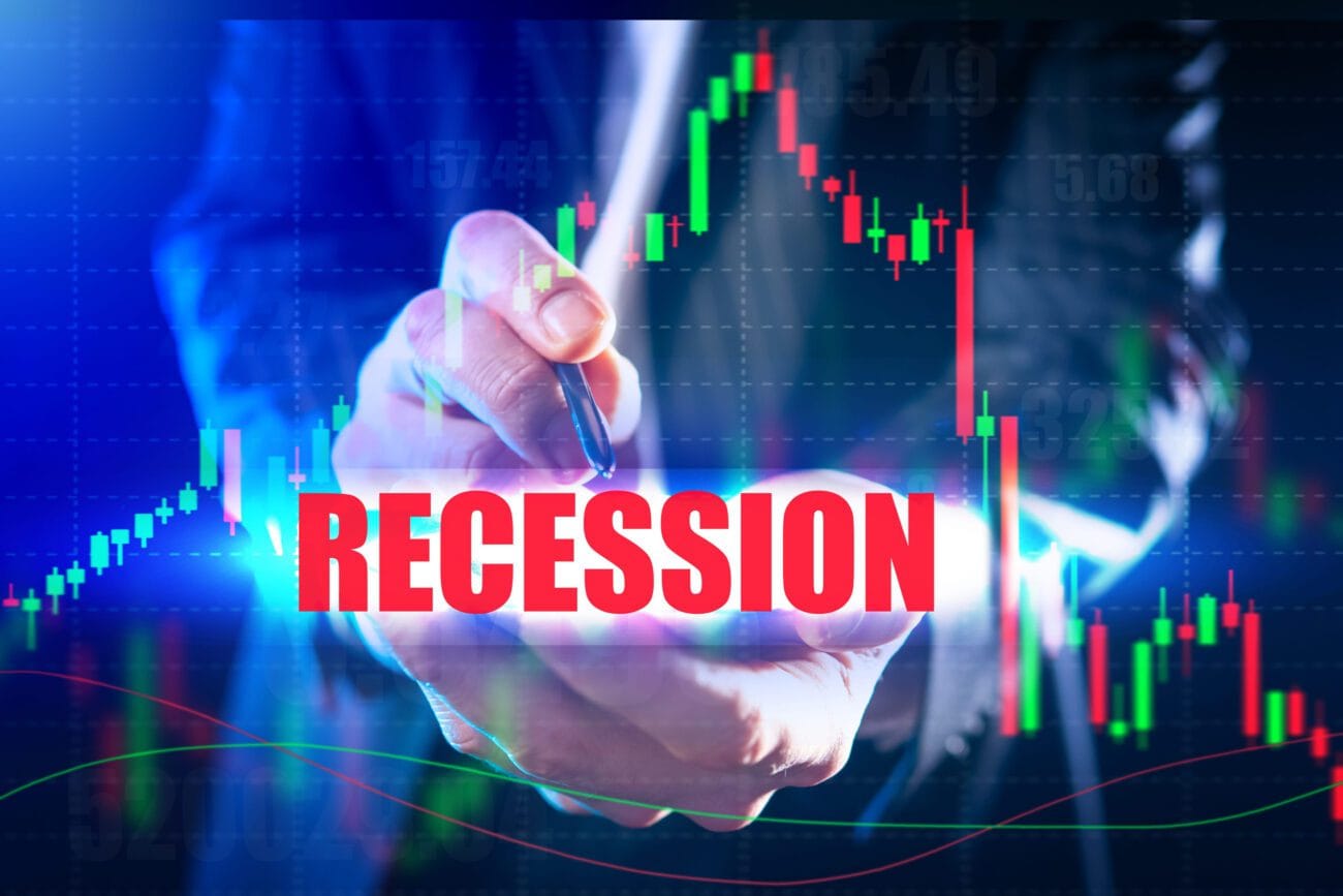 recesion 2027 - Hispamer Noticias Bold red RECESSION overlaying a trader's hand and a green/red stock chart, signaling economic downturn Hispamer Noticias